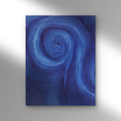 Blue spiral painting on a gray wall
