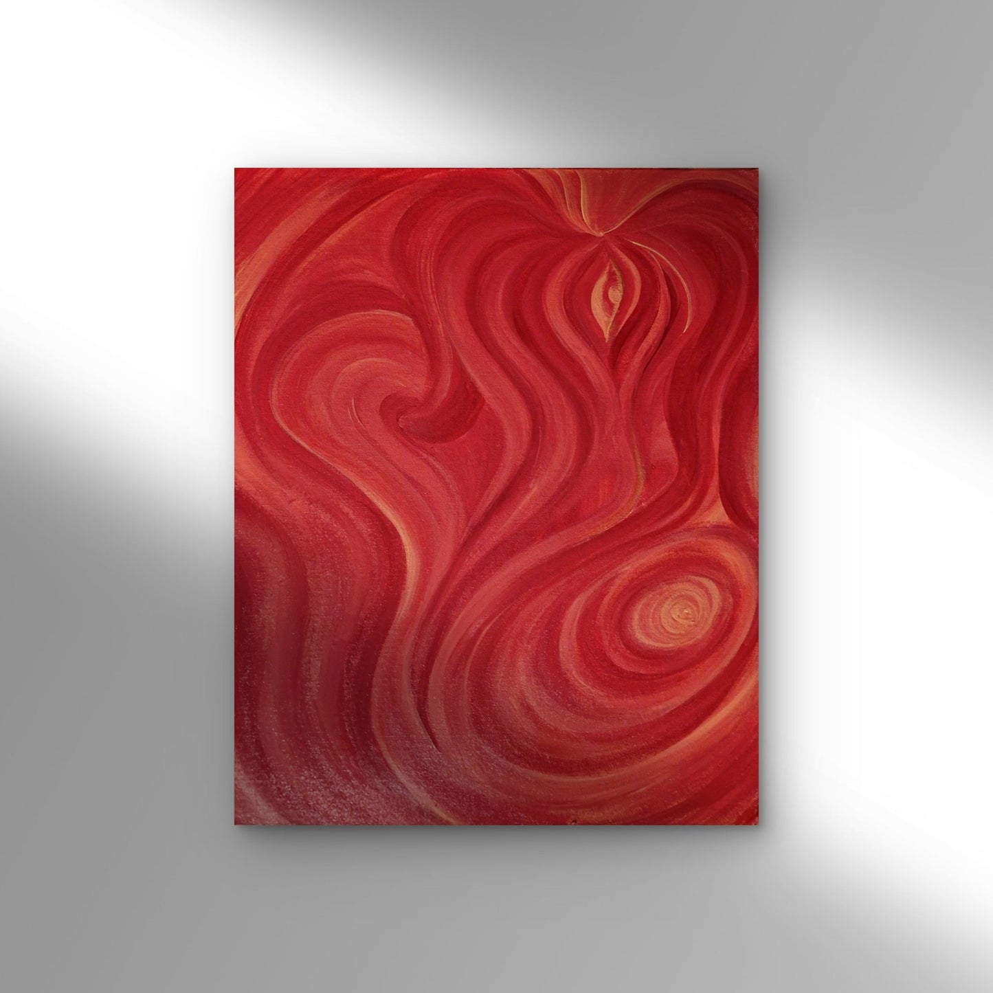Abstract red painting on a gray wall