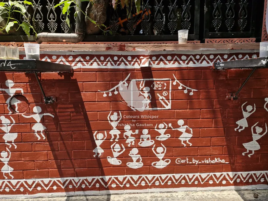 Warli mural by the café stairs