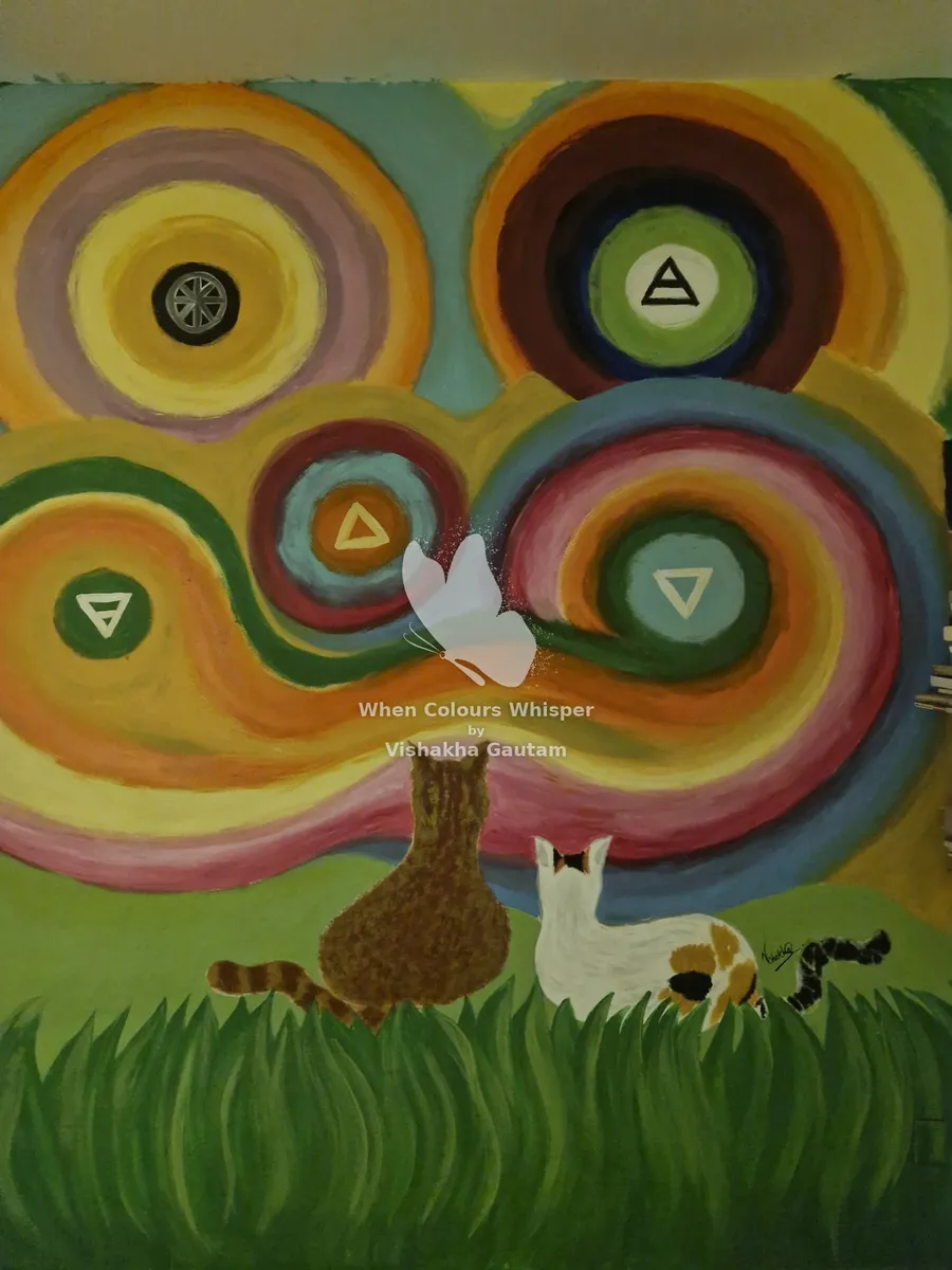 Mural of two cats under swirling elements