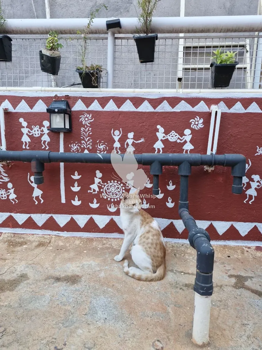 Warli Diwali scene with a cat